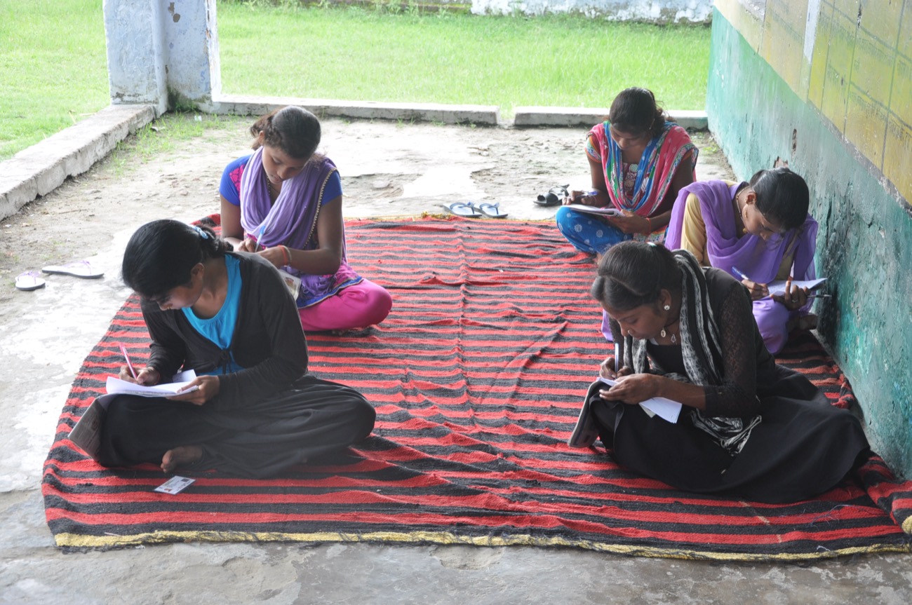 Girls writing their scholarship exam