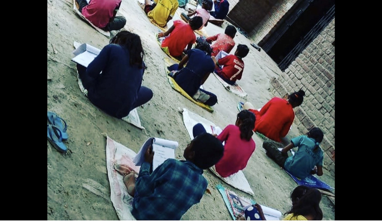 Class in session, mats laid out in a courtyard
