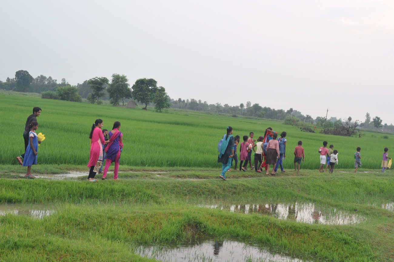 Children walking through fields