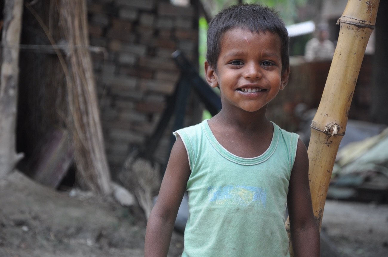 A child from Masauli village smiling, looking toward the future