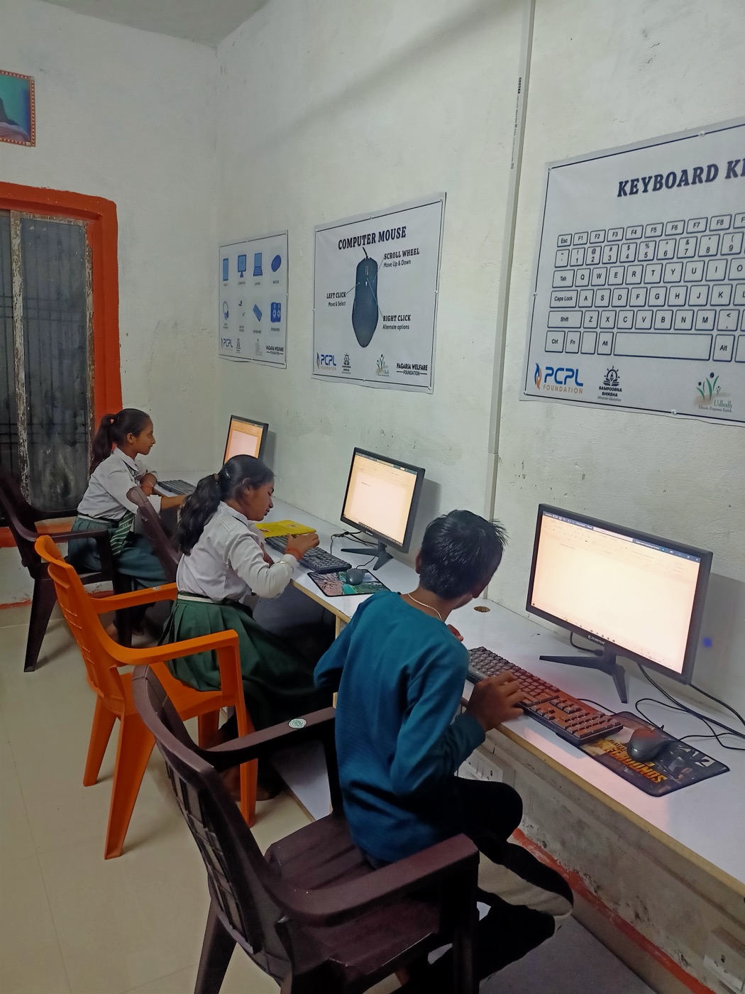 Children using computers at the Gajanand Learning Centre's small computer lab