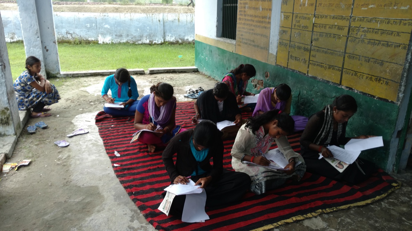 A girl in deep concentration writing during the Chatravriti scholarship exam
