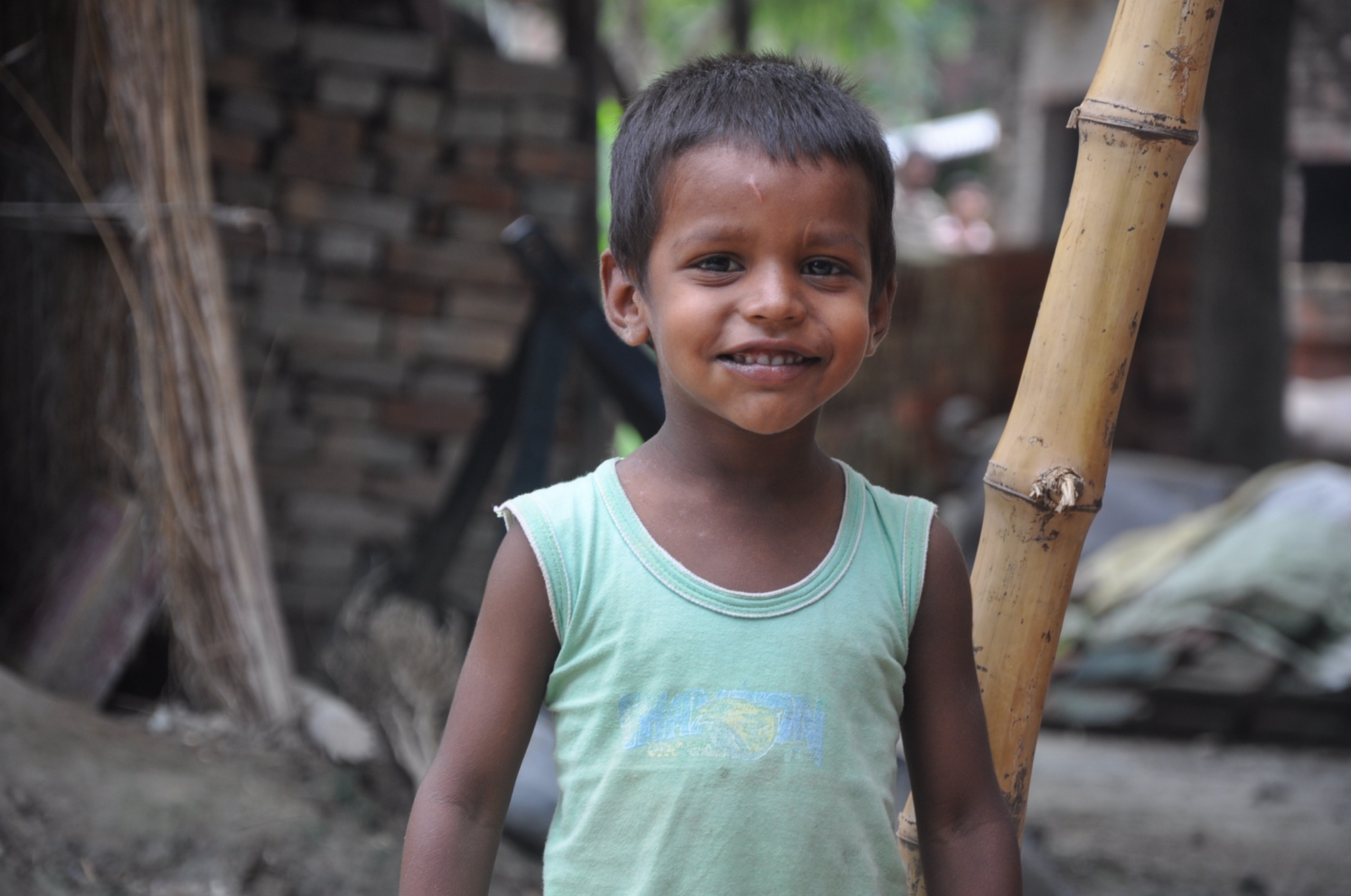 A laughing child in Masauli village at an Udbodh community camp
